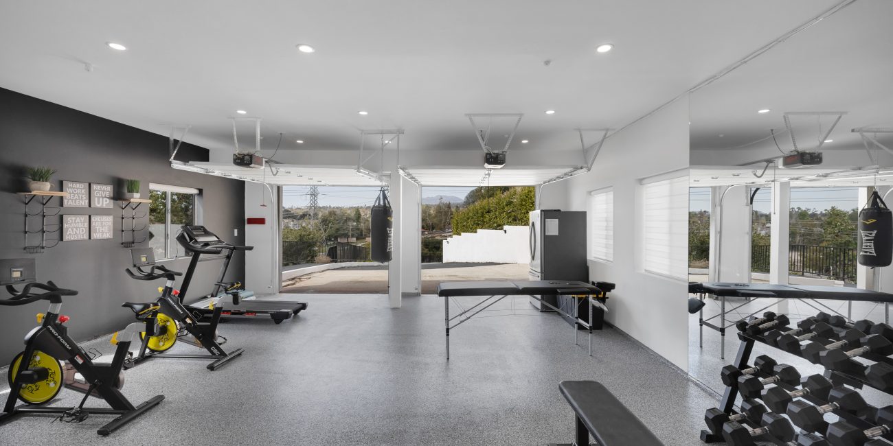 A wide view of the fitness center at Uplift Recovery Center