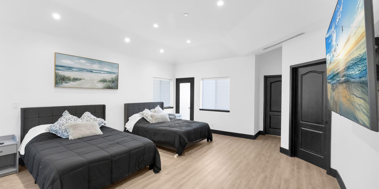A luxurious bedroom with 2 beds at Uplift Recovery Center