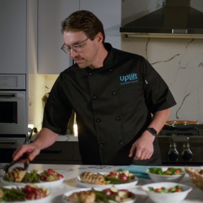 A personal chef preparing a delicious meal at Uplift Recovery Center