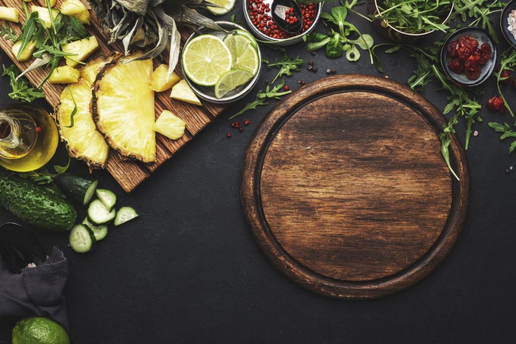 a variety of food and a cutting board, highlighting the importance of nutrition in addiction recovery