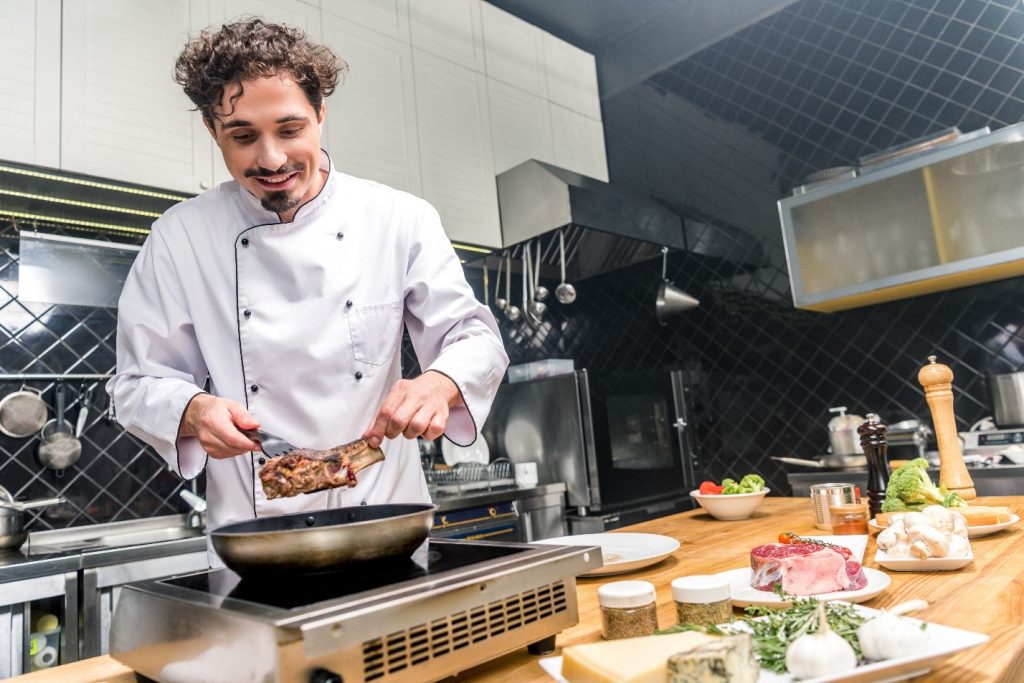 A private chef preparing a meal at Uplift Recovery