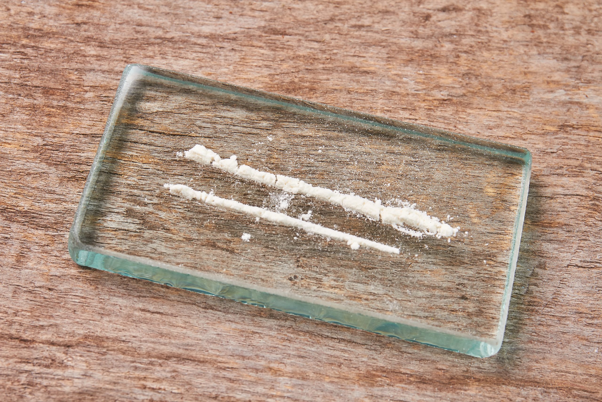 Lines of cocaine on glass, representing cocaine and alcohol addiction