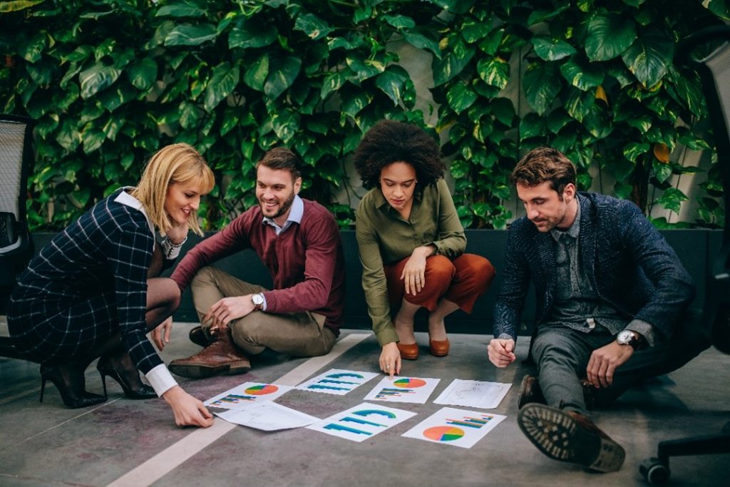 coworkers working together while dealing with work and recovery from addiction