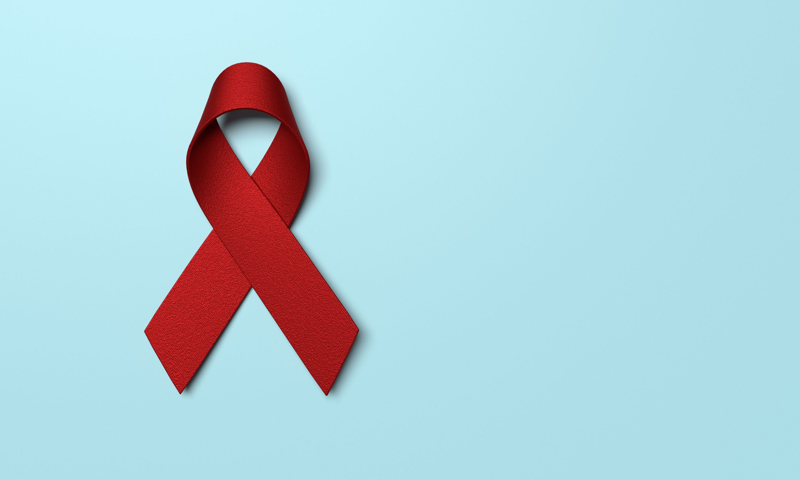 Red ribbon showing awareness for HIV and substance abuse