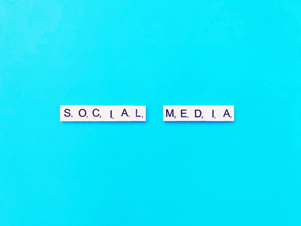 "social media" blocks against a blue background. This highlights the danger of social media and drugs