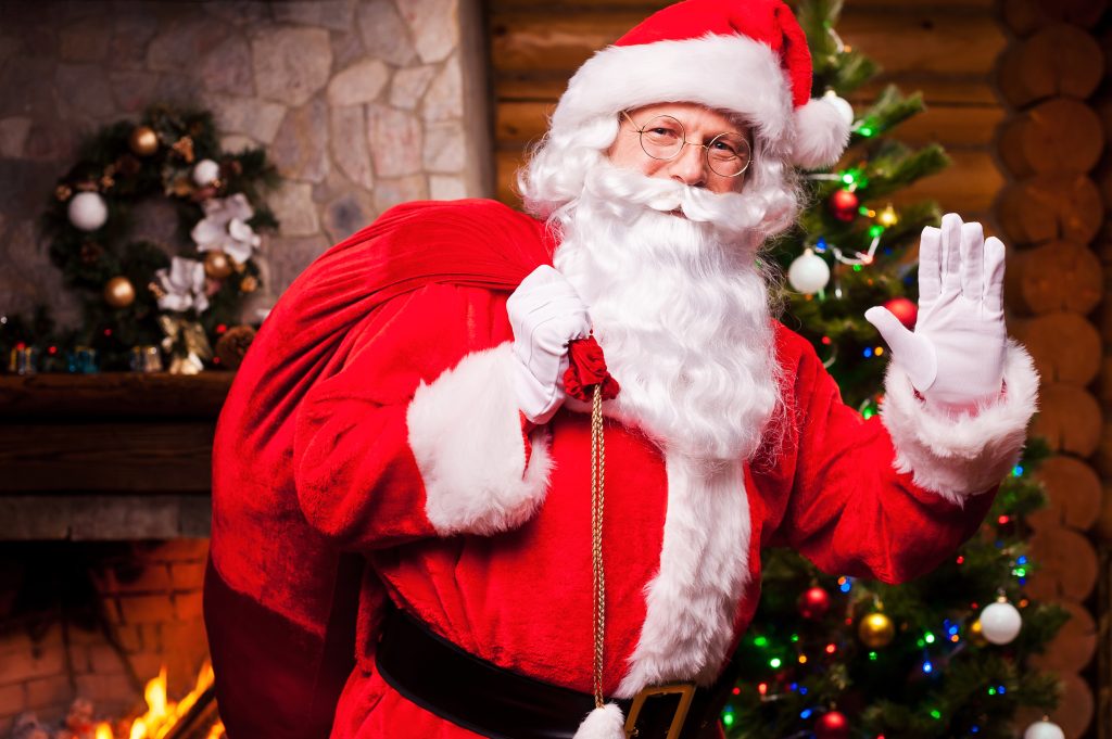 Santa waving to us carrying a bag of toys. Remember the importance of a sober Christmas for those in recovery.