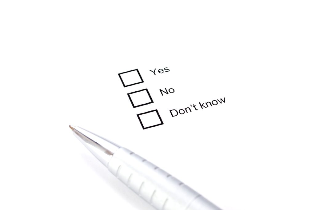 a pen with a question concept: yes, no, I don't know. This symbolizes the enabling an addict question