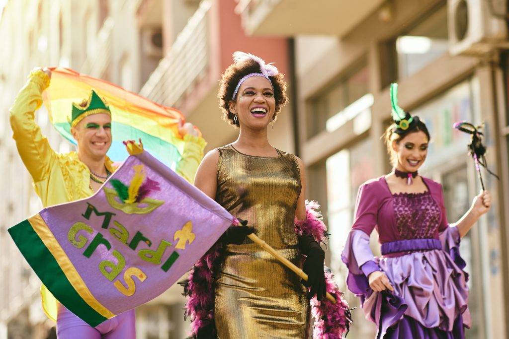 people in a street carnival celebrating a sober Mardi Gras