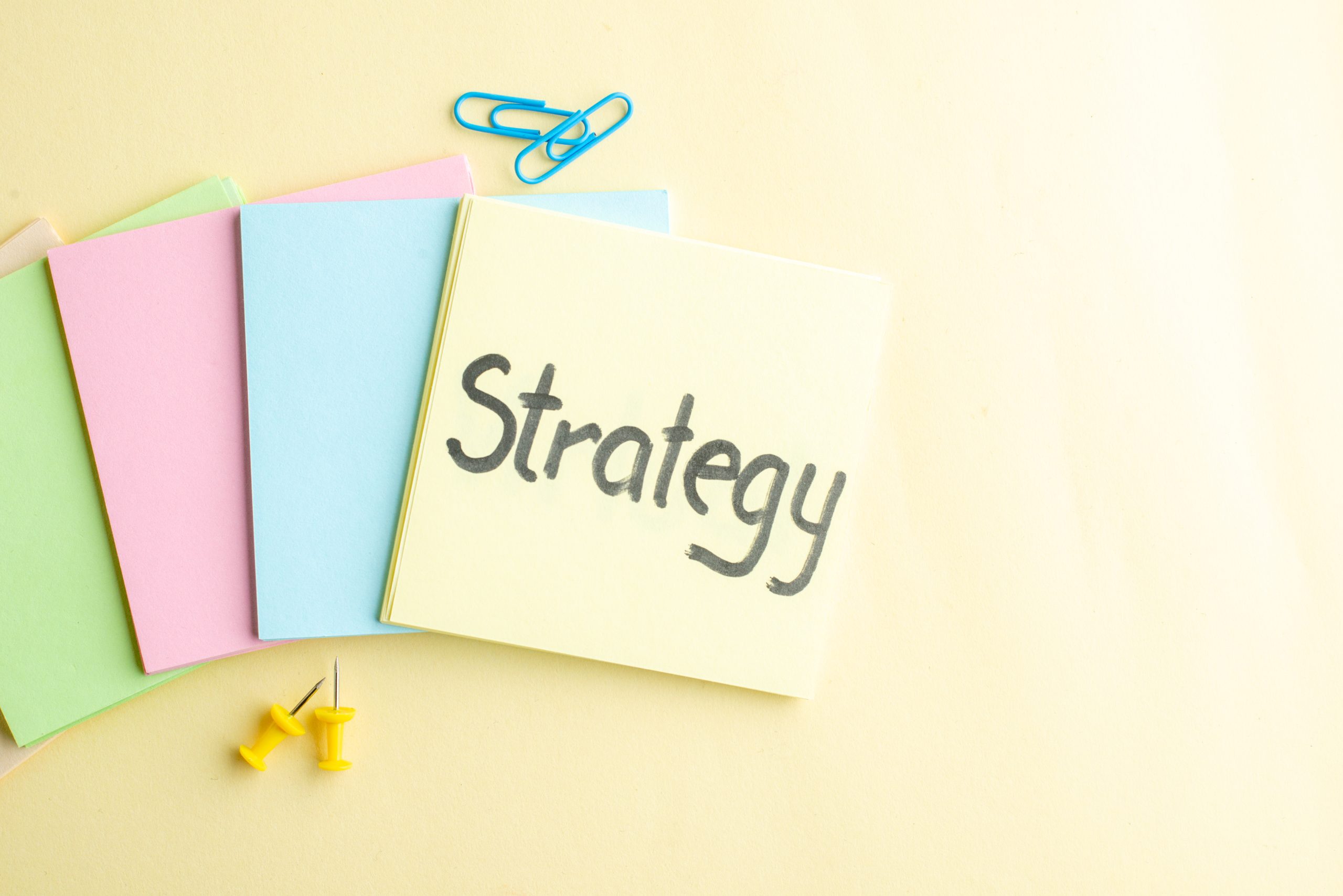 top view of colorful sticky notes with the top one saying "strategy" representing strategies on prevention for substance abuse