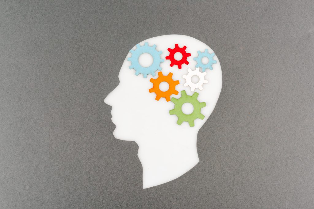 top view of a brain with colorful gears symbolizing brainspotting