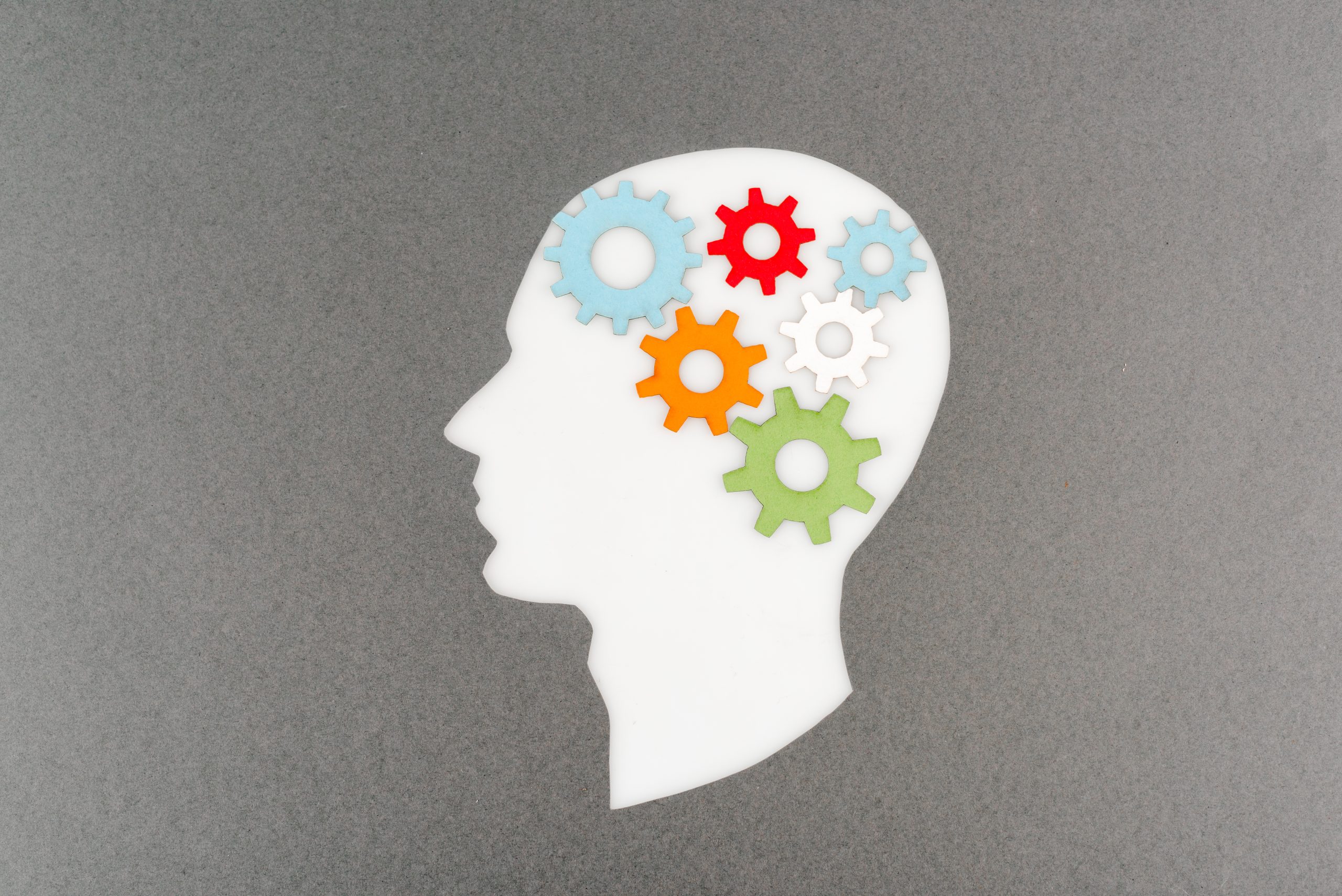 top view of a brain with colorful gears symbolizing brainspotting