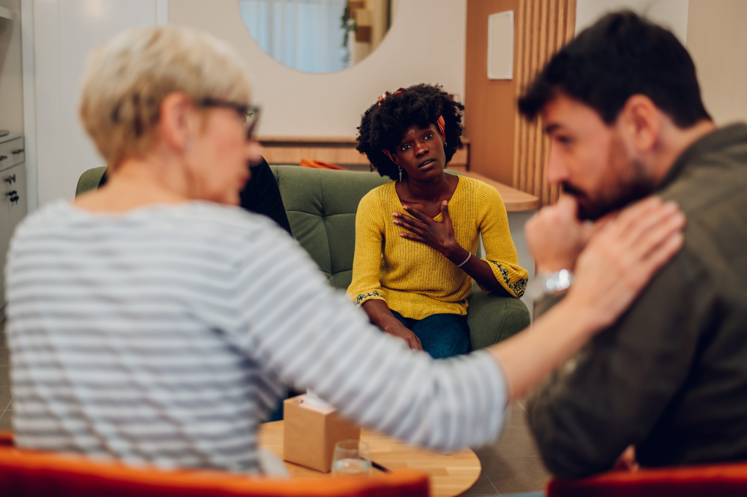 members comforting each other at a support group to show the different types of anonymous meetings for substance abuse