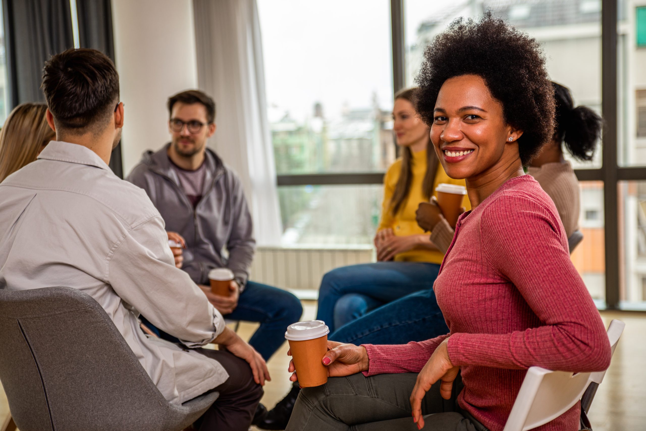 people discussing early recovery topics during group therapy